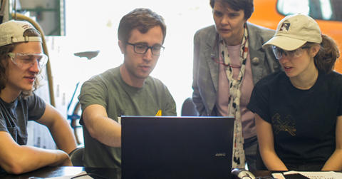 Students around computer